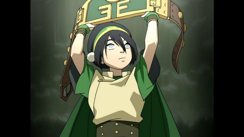 Toph holding up her championship belt.