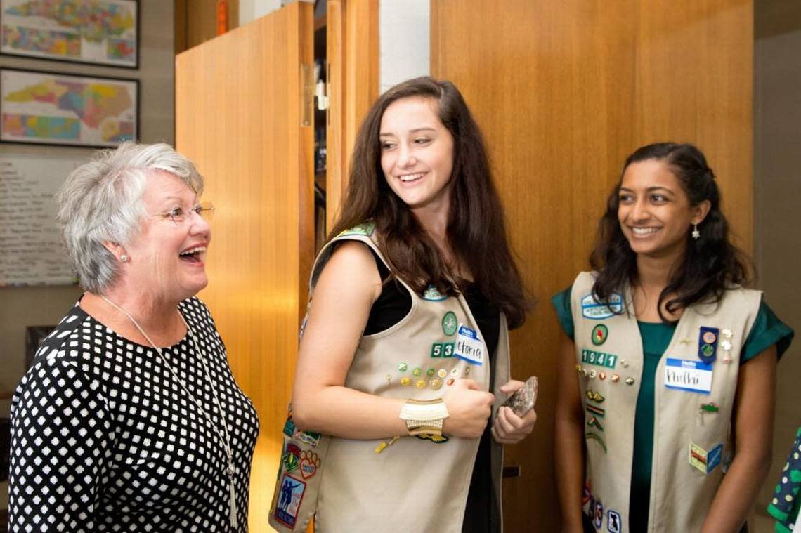 Grace Rogers, who works as a legislative assistant for Rep. David Lewis, welcomes Girl Scouts from the North Carolina Coastal Pines council to her office in the N.C. Legislative Building on Wednesday, April 26, 2017. Rogers – whose daughter is married to Lewis – says she serves as a sort of “mother bear” for her son-in-law.