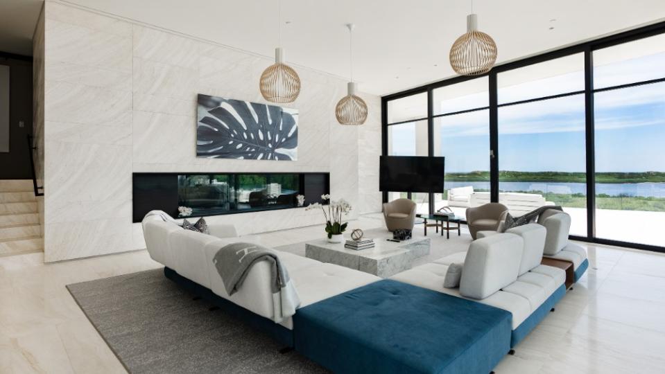 The living room, which overlooks the water. - Credit: The Corcoran Group