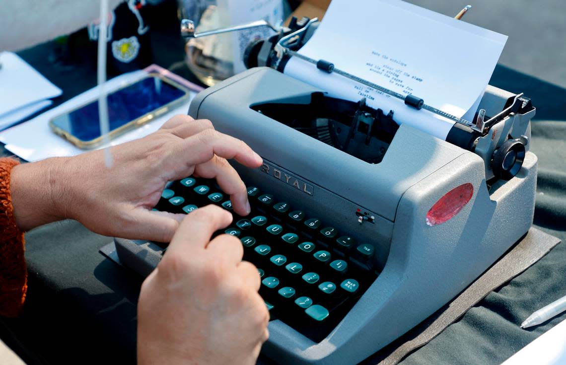 Chris Vitiello, otherwise known as the Poetry Fox, writes a poem on his 1953 Royal at the Hunt Street Art and Food Truck Market in Durham, N.C., Saturday morning, June 24, 2023.