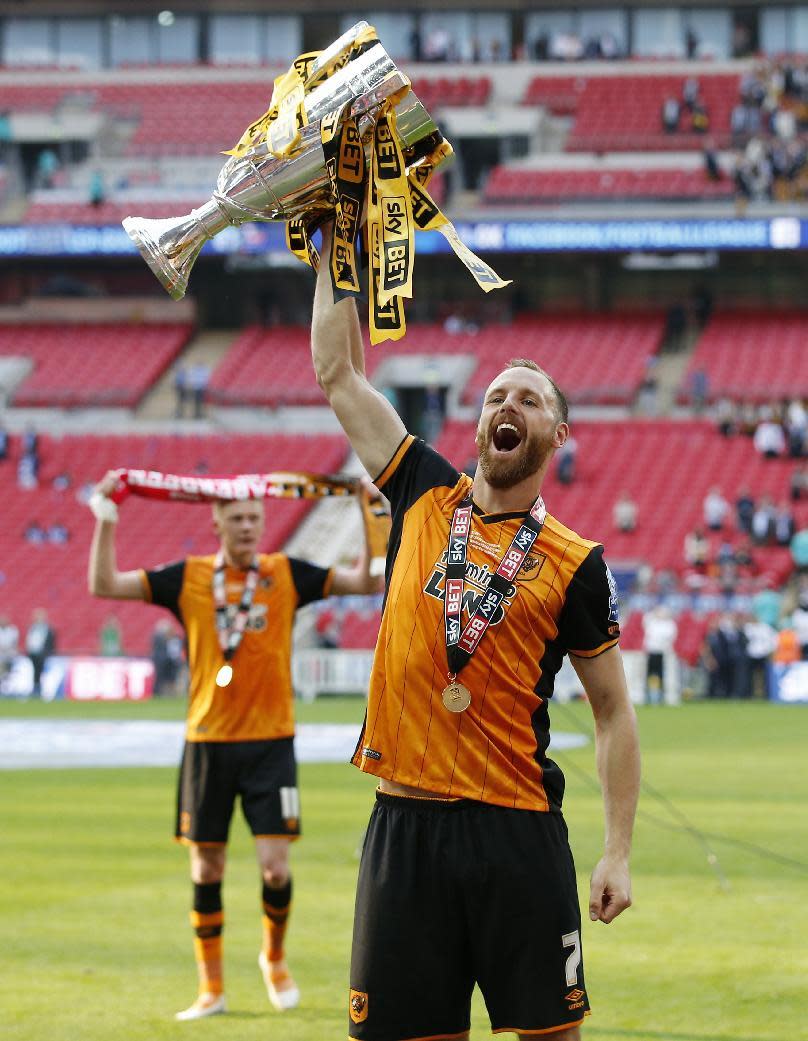 Britain Soccer Football - Hull City v Sheffield Wednesday - Sky Bet Football League Championship Play-Off Final - Wembley Stadium - 28/5/16 Hull City's David Meyler celebrates with the trophy after winning promotion back to the Premier League Action Images via Reuters / Andrew Couldridge Livepic EDITORIAL USE ONLY. No use with unauthorized audio, video, data, fixture lists, club/league logos or "live" services. Online in-match use limited to 45 images, no video emulation. No use in betting, games or single club/league/player publications. Please contact your account representative for further details.