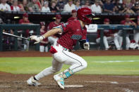 Arizona Diamondbacks' Corbin Carroll watches the flight of his two-run single against the St. Louis Cardinals during the fifth inning of a baseball game Sunday, April 14, 2024, in Phoenix. (AP Photo/Ross D. Franklin)