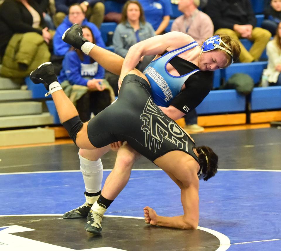 Horseheads' Hunter Lavigne, top, wrestles Elmira's Sam Brenen-Buseck in a 190-pound match during the final of the Section 4 Division I Dual Meet Tournament on Jan. 17, 2024 at Horseheads High School. Lavigne won by fall and Horseheads took the title, 51-14.