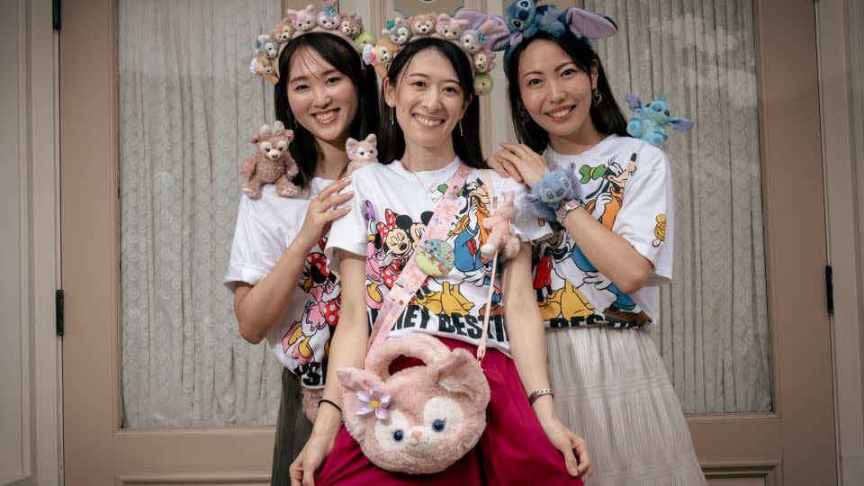 Mariko Otomo, 37, (C) poses with Nozomi Yasuda, 39 (L) and Yuka Izawa, 37, (R). This was the Japanese visitors' second day at the park. - Noemi Cassanelli/CNN