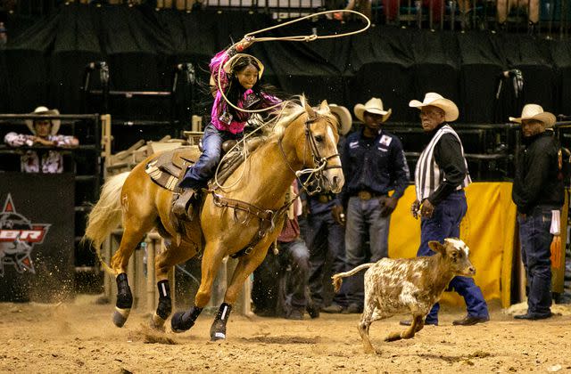 <p>Jason Armond/Los Angeles Times via Getty</p> Kortnee Solomon participates in final junior breakaway competition at the Bill Pickett Invitational Rodeo on Sunday, June 13, 2021 in Las Vegas, CA.