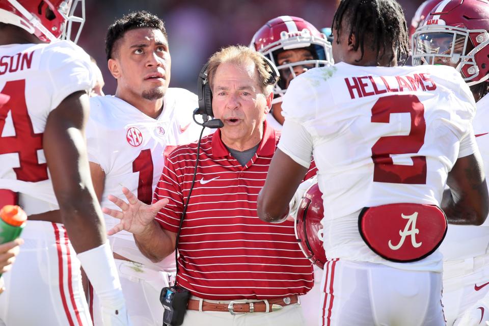 Alabama head coach Nick Saban talks to his players during the second quarter against Arkansas.