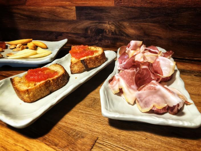 Tapas are served at the Jam&#xf3;n Jam&#xf3;n food-hall bar, which specializes in fine hams and cheeses in Delray Beach