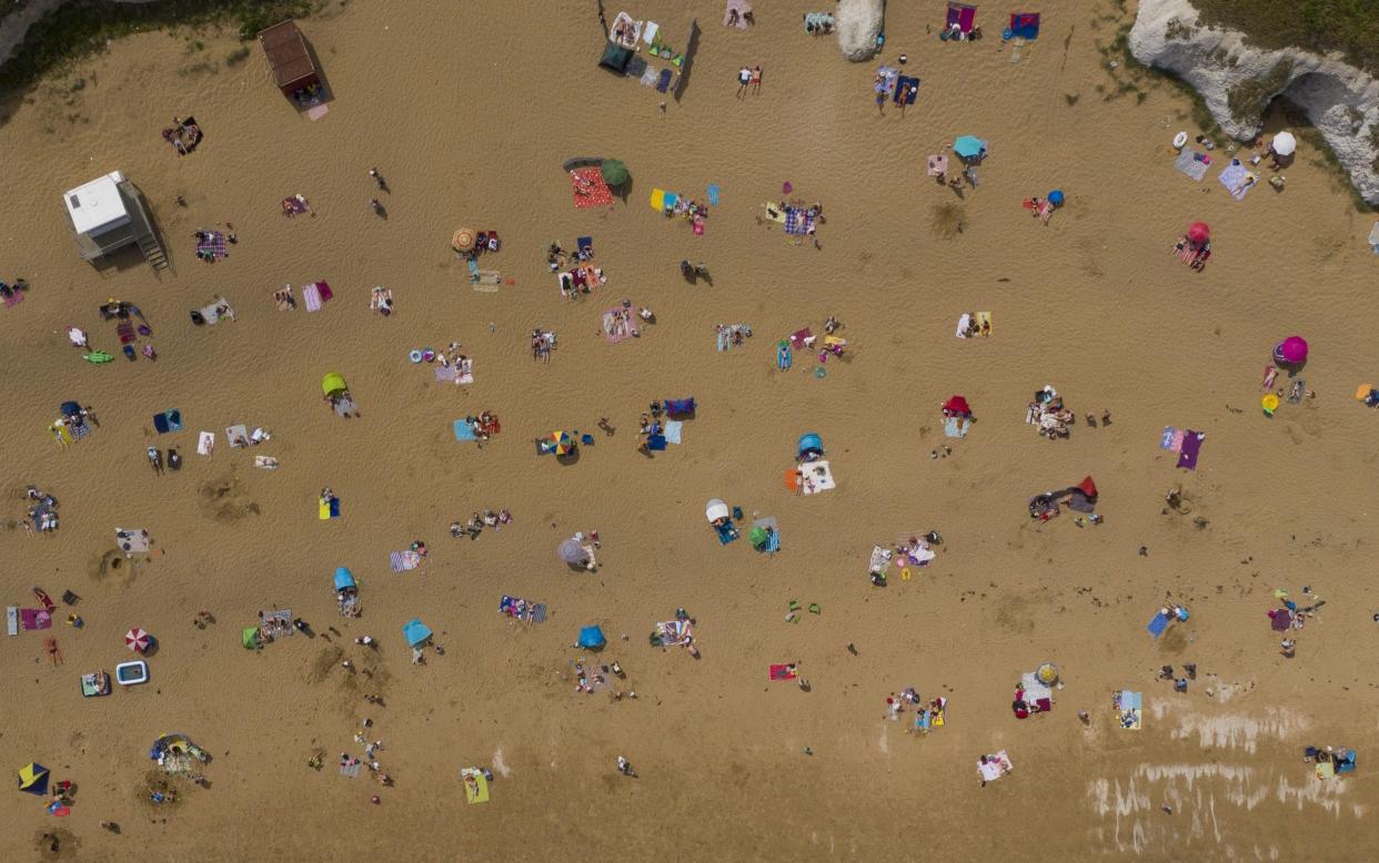 Bathers comply with social distancing in Margate during the May bank holiday weekend - Dan Kitwood/Getty Images