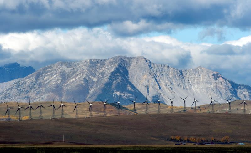 FILE PHOTO: Windmills generate electricity in the windy rolling foothills of the Rocky Mountains near the town of Pincher Creek