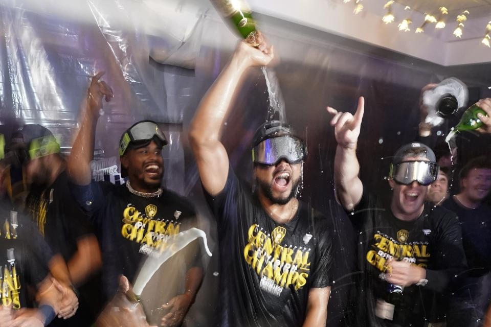 Milwaukee Brewers' Joel Payamps celebrates with teammates after clinching the National League Central Division after a baseball game against the St. Louis Cardinals Tuesday, Sept. 26, 2023, in Milwaukee. (AP Photo/Morry Gash)