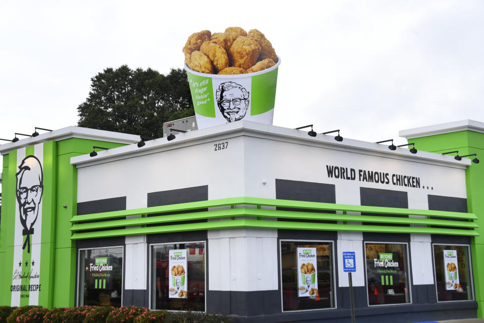 IMAGE DISTRIBUTED FOR BEYOND MEAT-  KFC and Beyond Meat launched plant-based chicken at a local Atlanta KFC, featuring an oversized 12 ft x 9ft bucket, accented by KFC's temporarily green exterior, Tuesday, Aug. 27, 2019. (John Amis/AP Images for Beyond Meat)