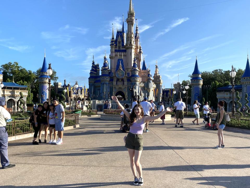 Insider reporter Amanda Krause poses in front of Disney World's Cinderella Castle.