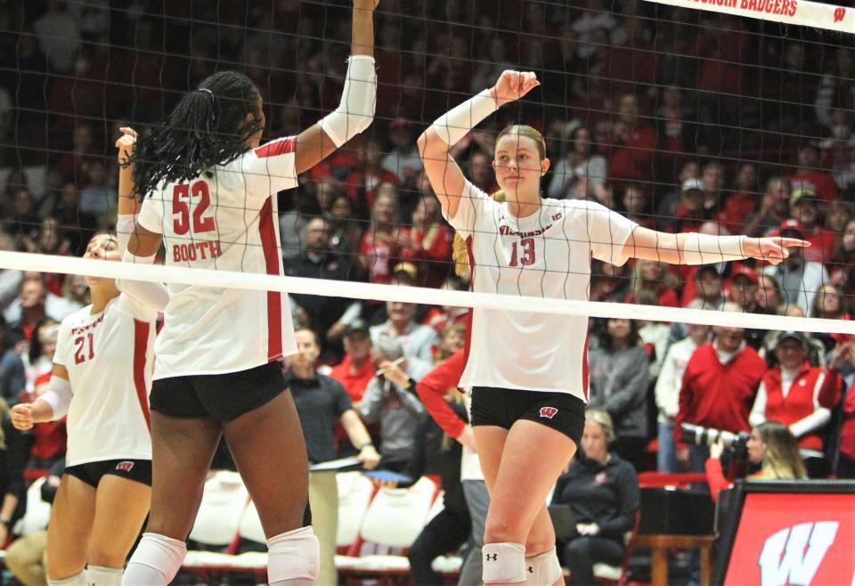 Wisconsin's Sarah Franklin (13) celebrates with Carter Booth after ending the first set with a kill during the team's match with Rutgers at the UW Field House in Madison, Wis. on Friday Oct. 13, 2023.