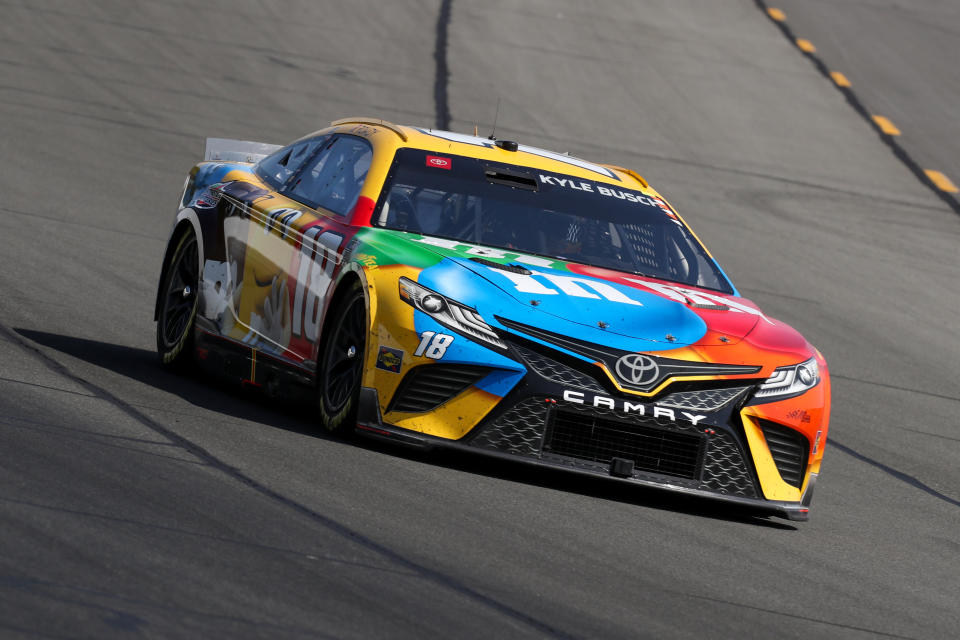 Jul 24, 2022; Long Pond, Pennsylvania, USA; NASCAR Cup Series driver Kyle Busch (18) races during the M&MÕS Fan Appreciation 400 at Pocono Raceway. Mandatory Credit: Matthew OHaren-USA TODAY Sports