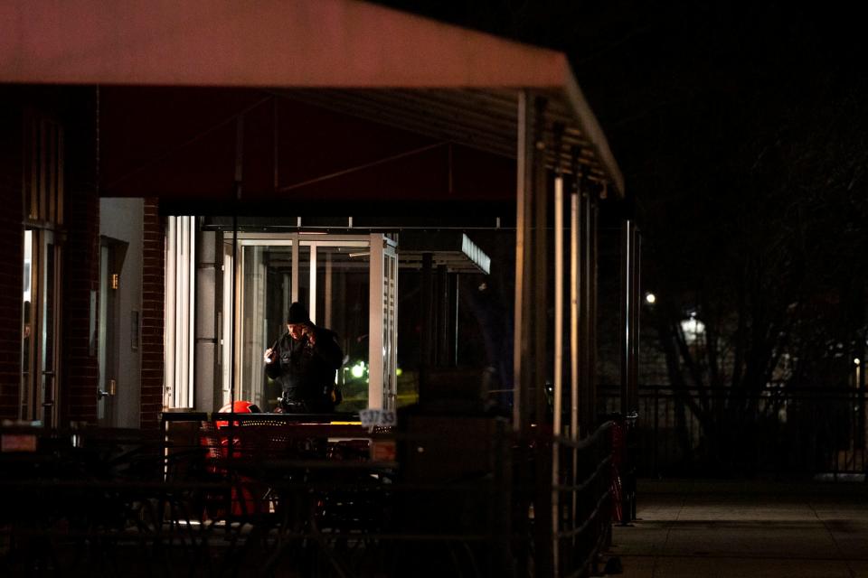 Police work a crime scene at Newport on the Levee in Newport, Ky., on Saturday, March 16, 2024.