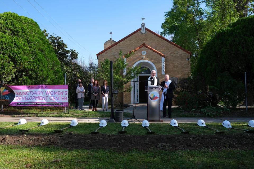 Archbishop Paul S. Coakley provides the invocation and site blessing Tuesday at the groundbreaking ceremony for the new Catholic Charities Sanctuary Women's Development Center, a day shelter for women who are homeless or in need, on the grounds of the current center which was housed in a former Catholic church.