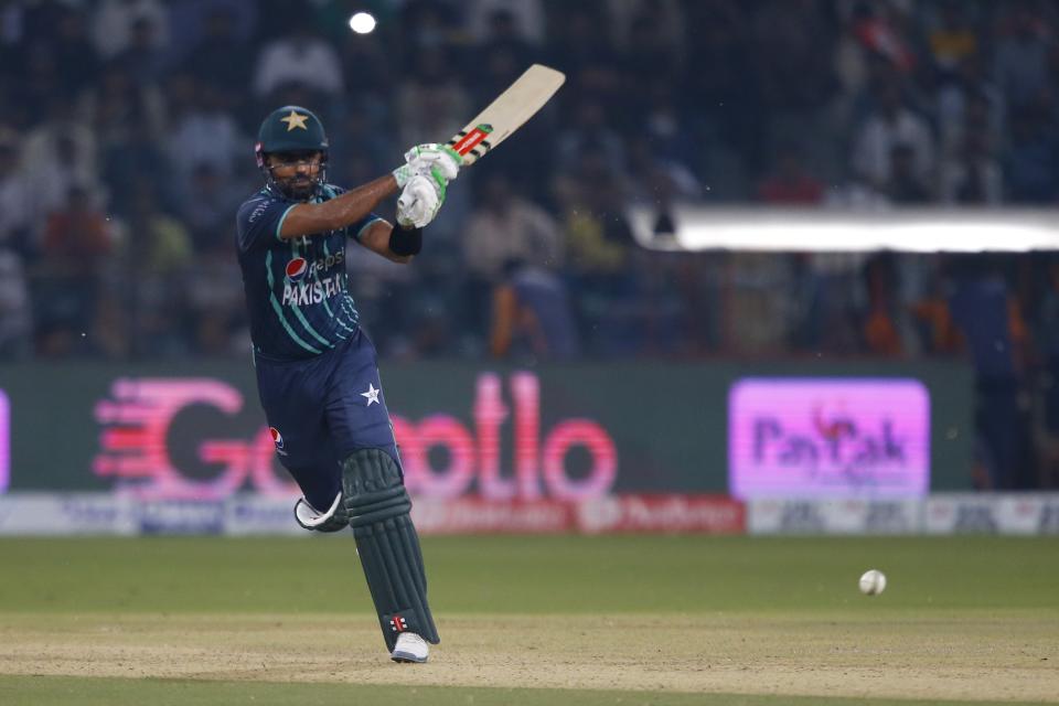 Pakistan's Babar Azam plays a shot during the sixth twenty20 cricket match between Pakistan and England, in Lahore, Pakistan, Friday, Sept. 30, 2022. (AP Photo/K.M. Chaudary)