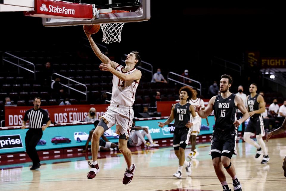 USC guard Drew Peterson drives to the basket to score against Washington State in the first half Saturday.