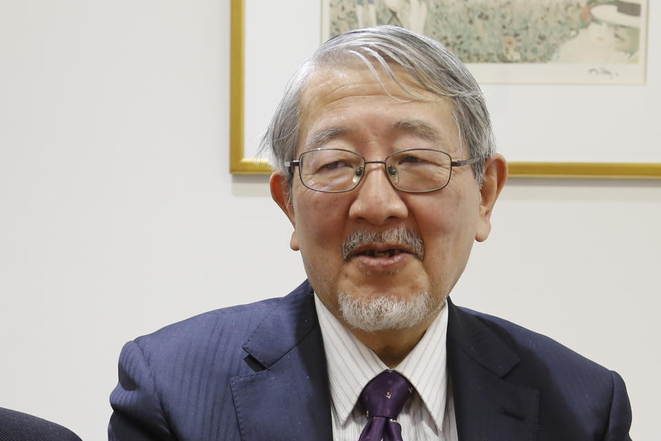 Yoichi Kitamura, the defense lawyer for Greg Kelly, who is on trial in Japan on charges related to former Nissan Chairman Carlos Ghosn’s compensation, speaks to The Associated Press at his Tokyo office Friday, March 5, 2021. The lawyer for former Nissan Motor Co.'s executive Kelly, said his client was merely trying to prevent Ghosn from going to a rival automaker. (AP Photo/Yuri Kageyama)