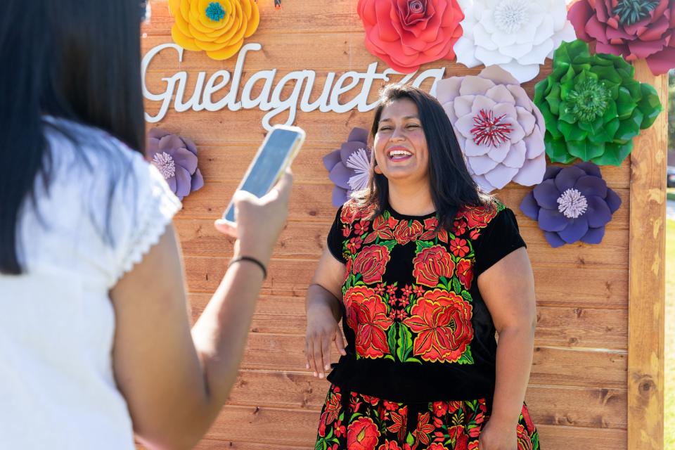 Susy Q’zzette Cruz takes a photo of Lizette Villegas at La Guelaguetza at Heritage Park in Kaysville on Saturday, July 22, 2023. La Guelaguetza is an event held to celebrate the rich culture and traditions of Oaxaca, Mexico. | Megan Nielsen, Deseret News