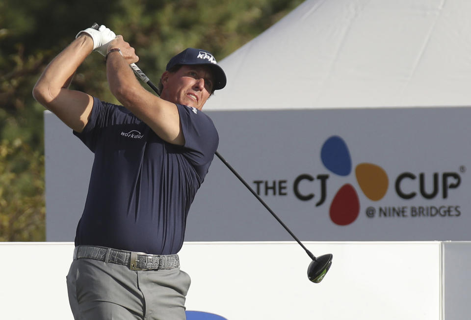 Phil Mickelson of the United States watches his shot on the 10th hole during the first round of the CJ Cup PGA golf tournament at Nine Bridges on Jeju Island, South Korea, Thursday, Oct. 17, 2019.(Park Ji-ho/Yonhap via AP)