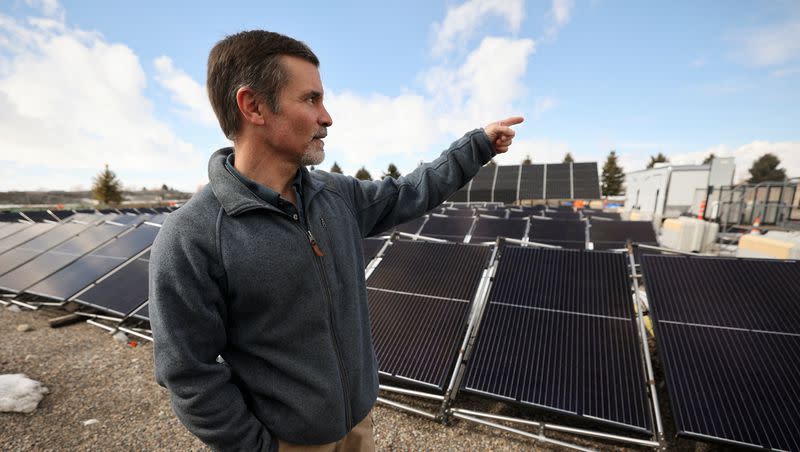 Kurt Myers, Idaho National Laboratory distributed energy and grid systems integration group lead, shows a microgrid outside of the INL Energy Systems Laboratory in Idaho Falls, Idaho, on Wednesday, April 5, 2023. The “grid-in-a-box” has solar panels that can be set up anywhere and attached to battery storage housed in a portable shipping container.