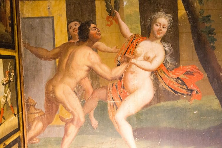 Paintings of a naked woman dancing with a naked man.