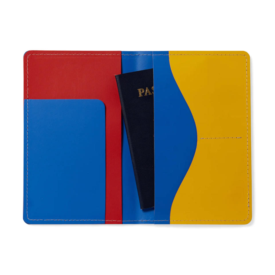 The blue, yellow and red MoMA Primary passport cover made of recycled leather