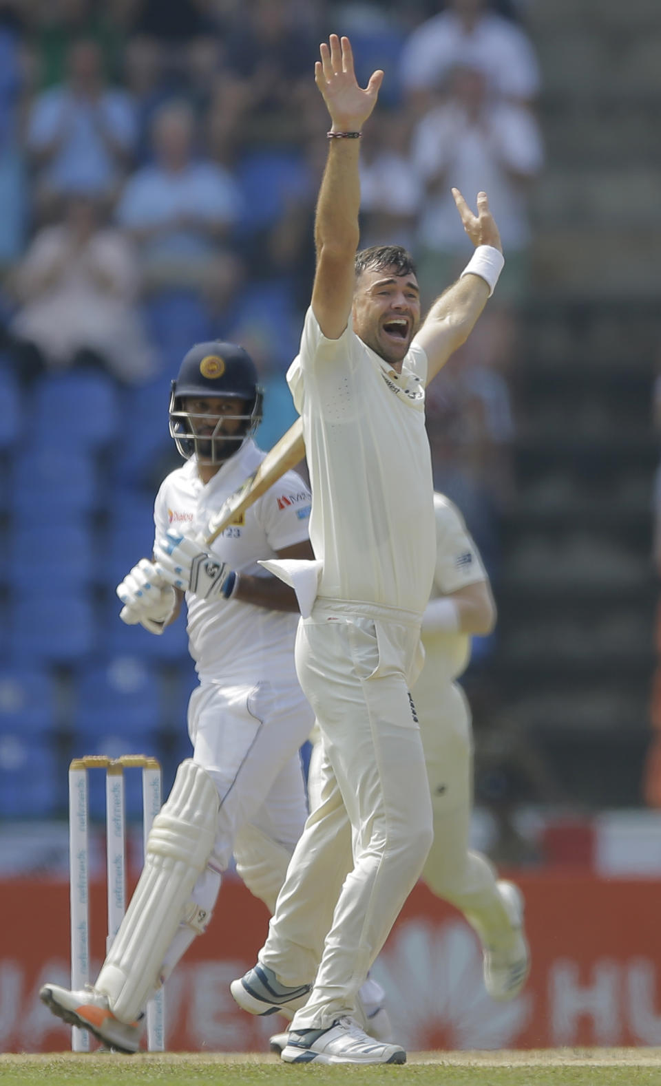 England's James Anderson unsuccessfully appeals for the wicket of Sri Lanka's Dimuth Karunaratne during the fourth day of the second test cricket match between Sri Lanka and England in Pallekele, Sri Lanka, Saturday, Nov. 17, 2018. (AP Photo/Eranga Jayawardena)