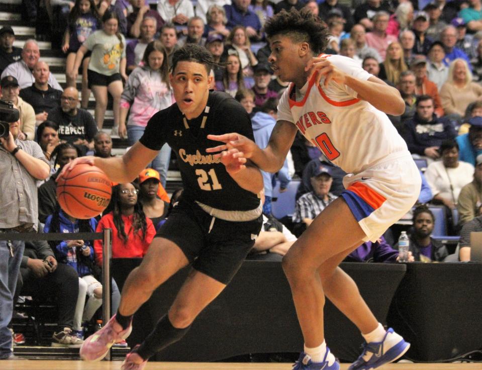 Sacred Heart-Griffin's Zack Hawkinson drives against East St. Louis' Cameron Boone during the Class 3A boys basketball supersectional game at the Bank of Springfield Center on Monday, March 6, 2023.