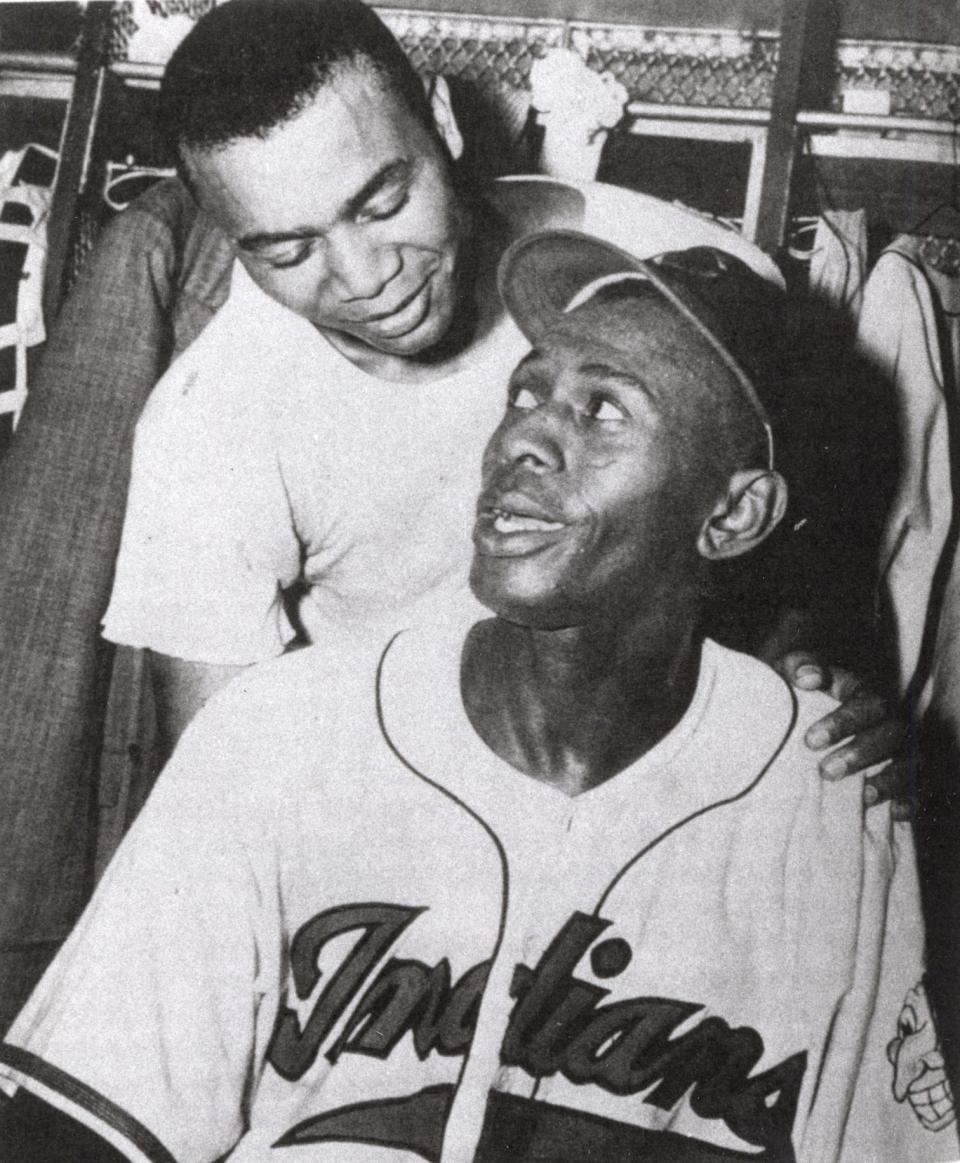 Larry Doby and Satchel Paige, roommates, congratulate each other after a 1-0 victory over the Chicago White Sox in 1948. Paige pitched his second straight shutout. a three hitter and Doby singled in the only run of the game in the fourth inning.