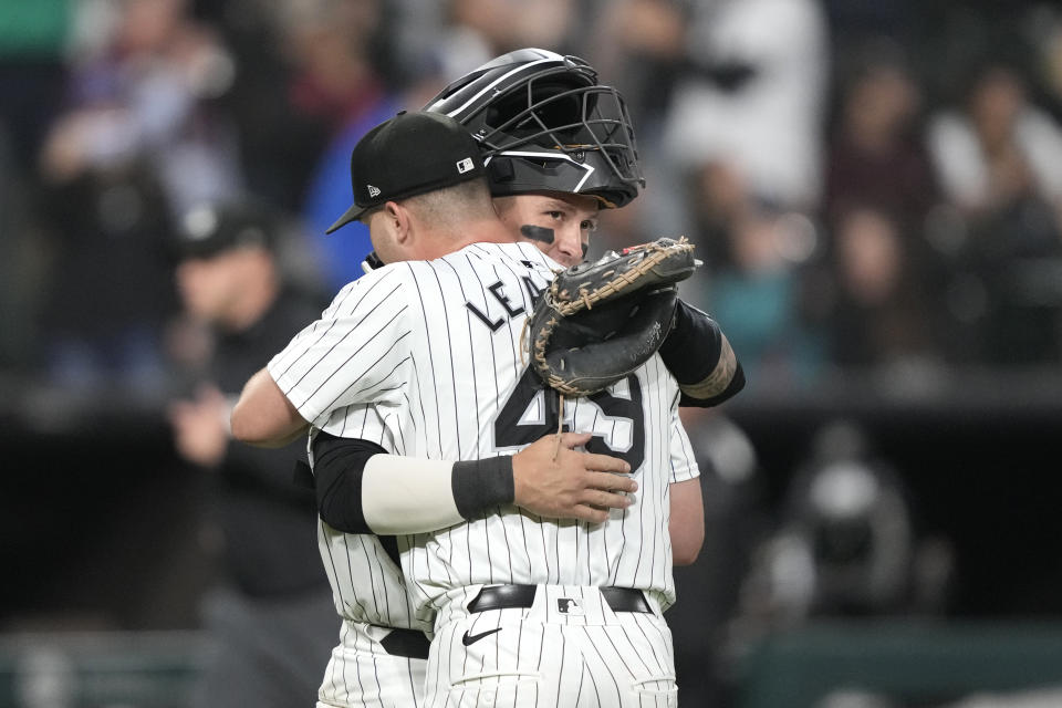 Chicago White Sox catcher Korey Lee, rear, and teammate Jordan Leasure celebrate the team's 6-3 win over the Cleveland Guardians in a baseball game Friday, May 10, 2024, in Chicago. (AP Photo/Charles Rex Arbogast)