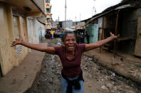 <p>A woman gestures as she mourns the death of a protester in Mathare, in Nairobi, Kenya, Aug. 9, 2017. (Photo: Thomas Mukoya/Reuters) </p>