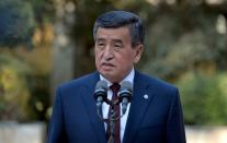 FILE PHOTO - Kyrgyzstan's President Sooronbai Jeenbekov speaks after a vote at a parliamentary elections in Bishkek