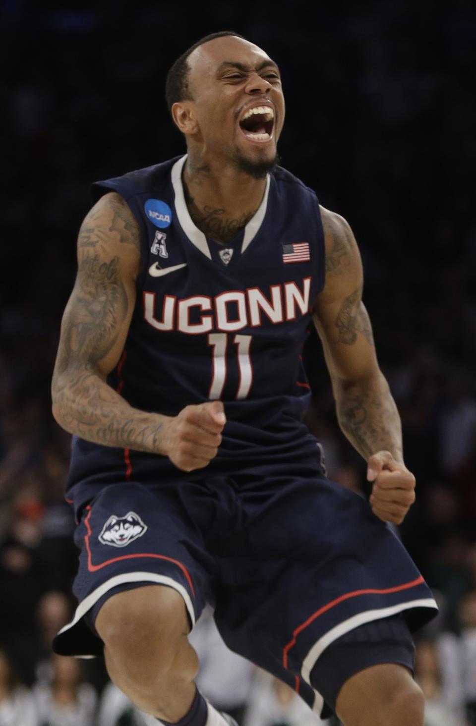 Connecticut's Ryan Boatright (11) celebrates during the second half of a regional final against Michigan State in the NCAA college basketball tournament Sunday, March 30, 2014, in New York. Connecticut won the game 60-54. (AP Photo/Frank Franklin II)