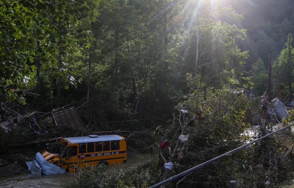 A Perry County school bus sits in Lost Creek in Breathitt County after the flash floods in Eastern Kentucky on July 27.  July 30, 2022