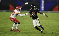Baltimore Ravens quarterback Lamar Jackson (8) scrambles away from Kansas City Chiefs linebacker Willie Gay Jr. (50) during the second half of an NFL football game, Monday, Sept. 28, 2020, in Baltimore. (AP Photo/Gail Burton)