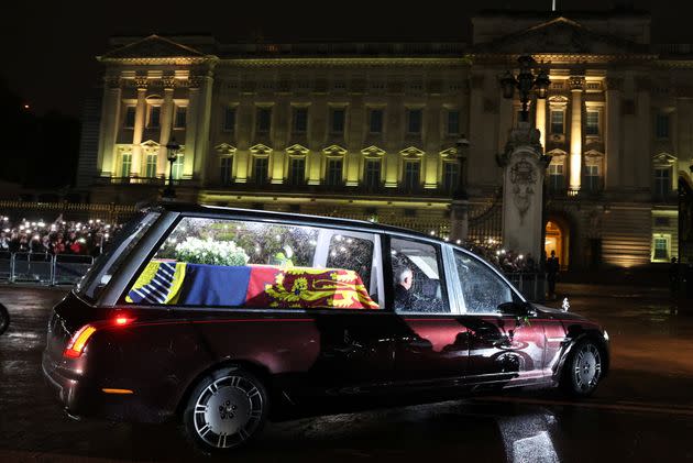 The hearse carrying the coffin of Queen Elizabeth II arrives at Buckingham Palace, London, where it will lie at rest overnight in the Bow Room. Picture date: Tuesday September 13, 2022. (Photo: Paul Childs via PA Wire/PA Images)