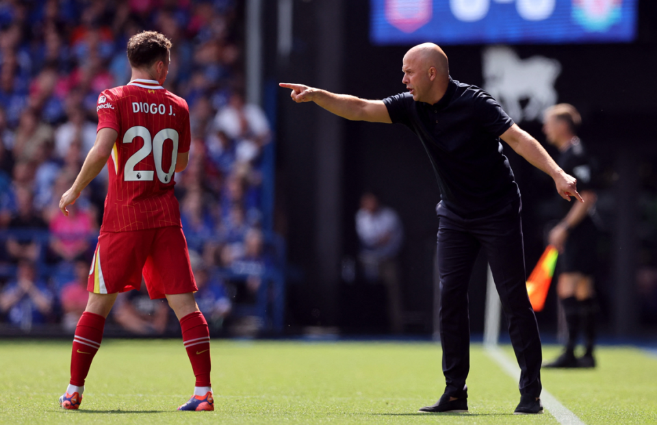 Liverpool boss Arne Slot gives instructions to Diogo Jota during the 2-0 win at Ipswich Town.