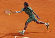 Gael Monfils of France returns the ball to Tomas Berdych of the Czech Republic during their men's singles semi-final tennis match at the Monte Carlo Masters in Monaco, April 18, 2015. REUTERS/Jean-Paul Pelissier