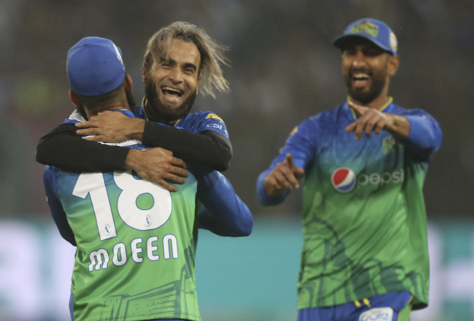 Imran Tahir, center, of Multan Sultan celebrates a dismissal of Karachi Kings' batsman during the Pakistan Super League T20 cricket match in Multan, Pakistan, Friday, Feb. 28, 2020. (AP Photo/K.M. Chaudhry)