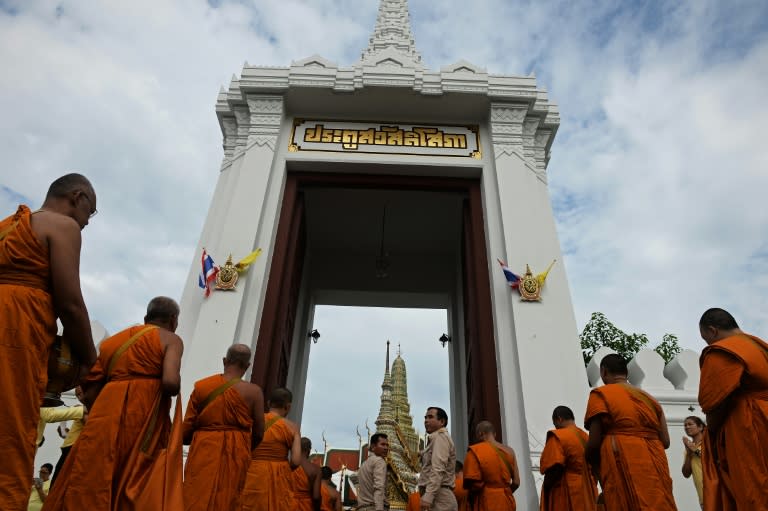 Some 770 monks began a day of celebration with an alms-giving ceremony