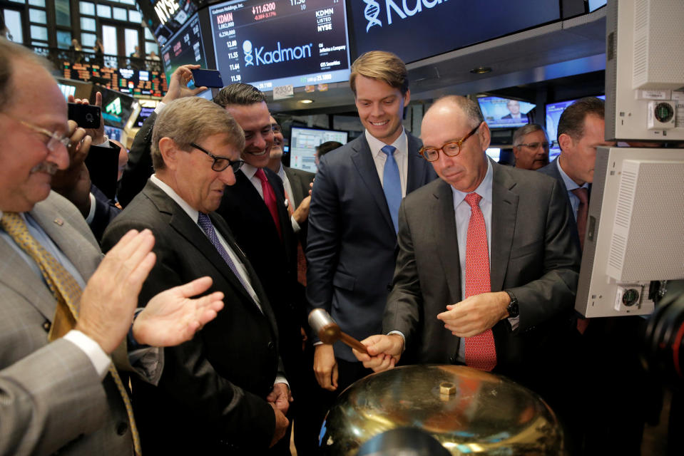 Harlan Waksal, (R) CEO of Clinical-stage biotech Kadmon Holdings LLC., rings a bell to celebrate his company’s IPO on the floor of the New York Stock Exchange (NYSE) in New York City, U.S., July 27, 2016. REUTERS/Brendan McDermid