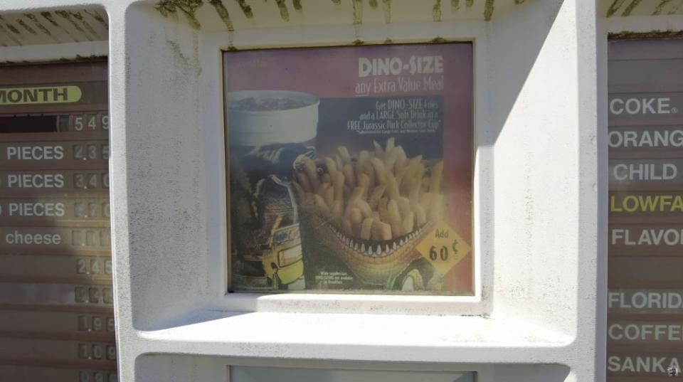 The menu was advertising “dino-size fries” for sale — potentially a tie-in to the 1993 “Jurassic Park” movie. YouTube / Chris Luckhardt
