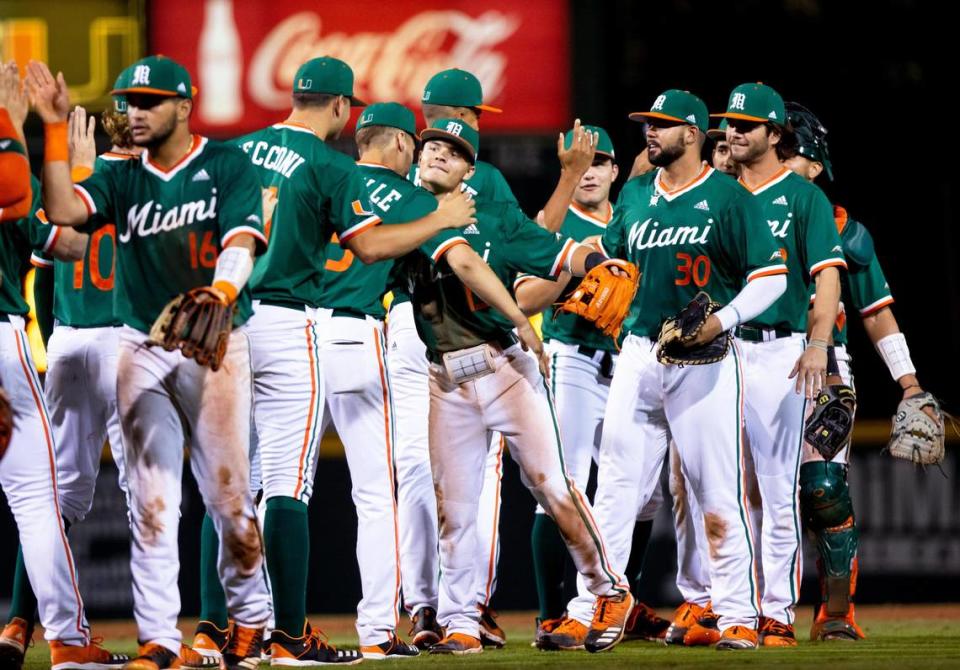 The Miami Hurricanes baseball team celebrates after a game against the Rutgers Scarlet Knights at Alex Rodriguez Park in Coral Gables, Florida on Friday, February 14, 2020.