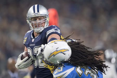 FILE PHOTO - Nov 23, 2017; Arlington, TX, USA; Dallas Cowboys tight end Jason Witten (82) stiff arms Los Angeles Chargers safety Tre Boston (33) during the second half at AT&T Stadium. The Los Angeles Chargers defeat the Dallas Cowboys 28-6. Mandatory Credit: Jerome Miron-USA TODAY Sports