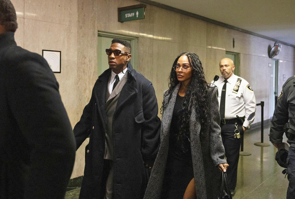 Jonathan Majors and Meagan Good arrive at court for a jury selection (Yuki Iwamura / AP)