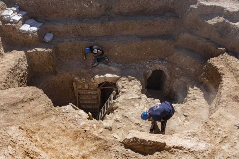 Workers are seen on a 1,200-year-old rural estate discovered during excavations by the Israel Antiquities Authority during expansion of the town of Rahat, Israel, Tuesday, Aug. 23, 2022. Located in Israel's south near the Bedouin town of Rahat, the building dates back back to the early Islamic period in the 8th or 9th centuries. (AP Photo/Tsafrir Abayov)