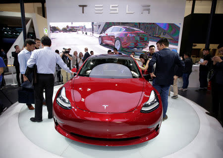 A Tesla Model 3 car is displayed during a media preview at the Auto China 2018 motor show in Beijing, China April 25, 2018. REUTERS/Jason Lee/Files