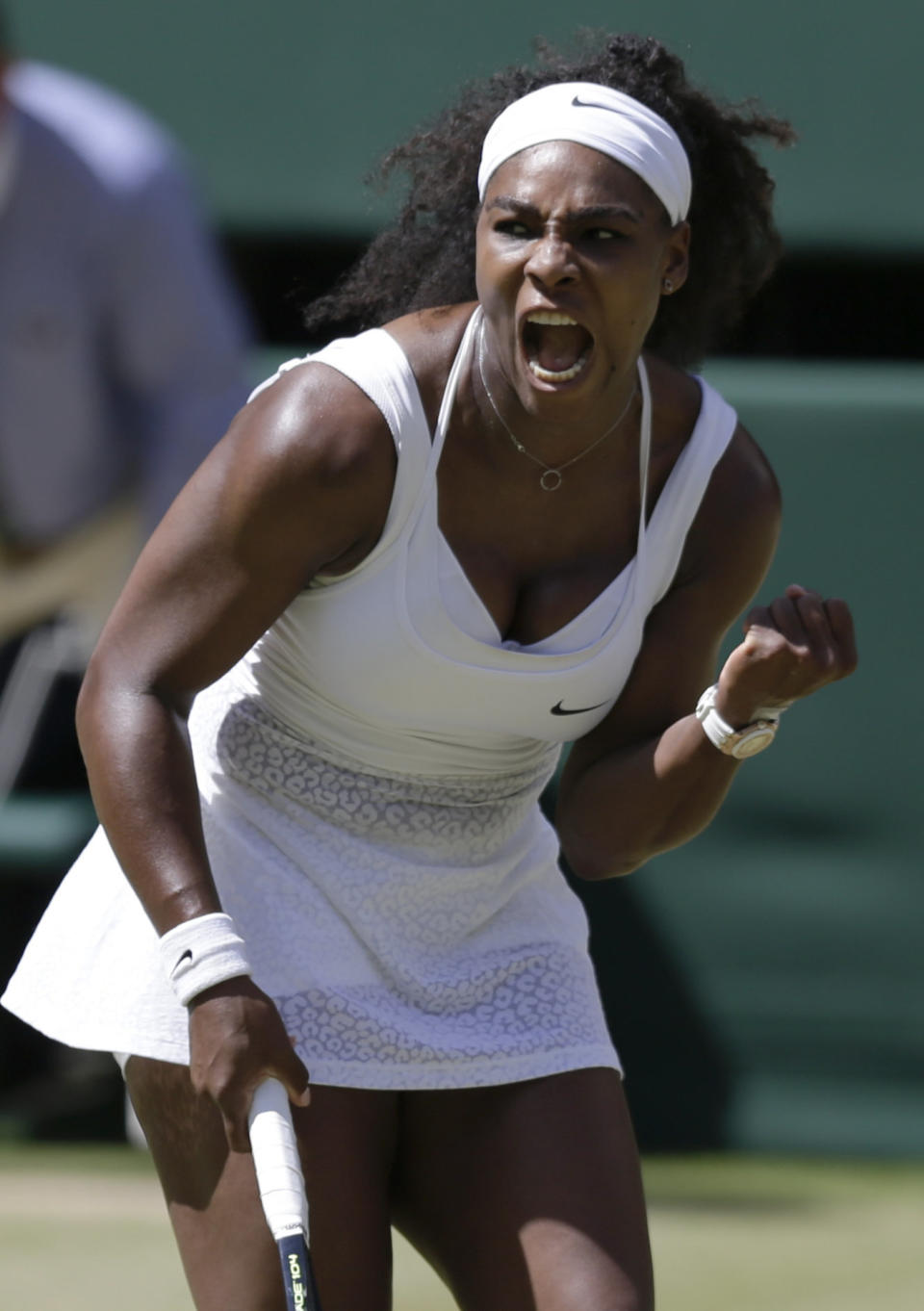 Serena Williams of the United States celebrates winning a point against Garbine Muguruza of Spain during the women's singles final at the All England Lawn Tennis Championships in Wimbledon, London, Saturday July 11, 2015. (AP Photo/Pavel Golovkin)